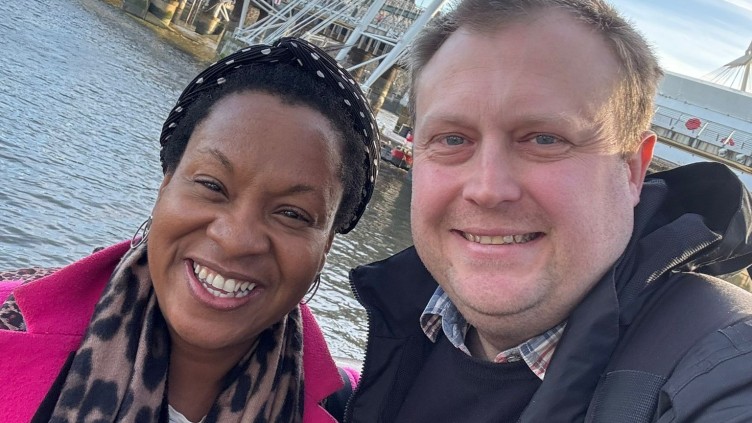 Louise wears a pink coat and Danny wears a black rain coat